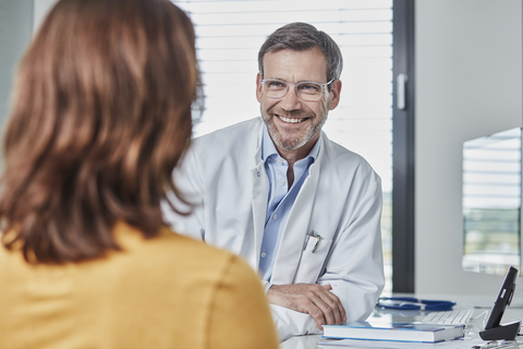 Physician patient talk stock photo
