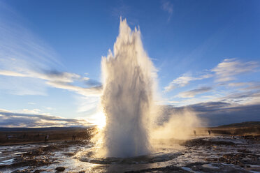 Landscape with active geyser erupting in the foreground. - MINF06581
