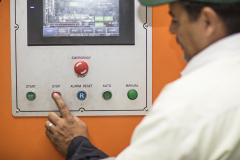 Worker using control panel stock photo