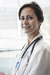 Caucasian female doctor in lab coat with stethoscope. - MINF06902