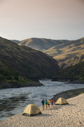A group white water rafting trip makes camp on the Salmon River. - AURF00019