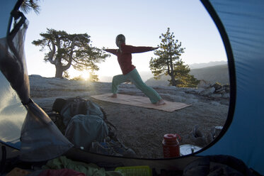 Yoga outside tent at sunrise. - AURF00107