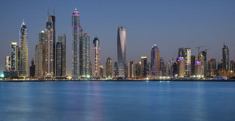 Cityscape of Dubai, United Arab Emirates, with skyscrapers lining the coastline of the Persian Gulf. - MINF07530