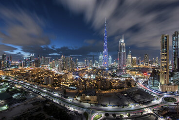 Cityscape of Dubai, United Arab Emirates at dusk, with illuminated Burj Khalifa skyscraper in the centre. - MINF07549