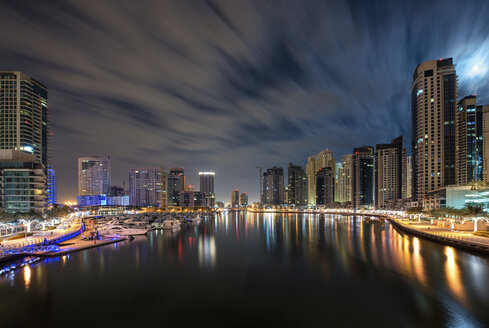 Cityscape of Dubai, United Arab Emirates at dusk, with skyscrapers and the marina in the foreground. - MINF07551