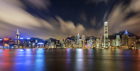 Aerial view of Hong Kong cityscape with illuminated skyscrapers at dusk. - MINF08053