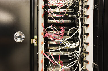 Closeup of CAT 5 cable bundle system in a computer server room - MINF08301