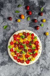 Unbaked pizza with tomatoes and basil leaves - SARF03898