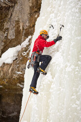 A man is climbing a frozen waterfall in Sounkyo Gorge, Daisetsuzan National Park, Hokkaido, Japan - AURF00226