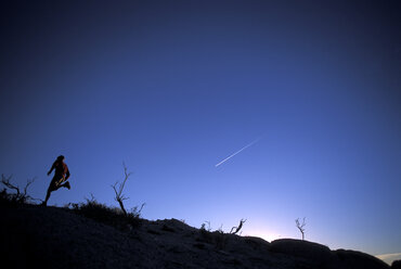 Young man running at sunrise near Lake Tahoe, CA. - AURF00279