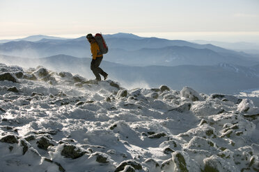 A Summit Intern hikes the northwest area of Mt. Washington's summit cone during some time off from his work. - AURF00309