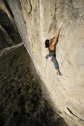 A rock climber ascends a steep rock face in Mexico. - AURF00371