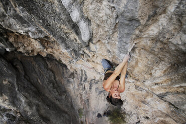 A rock climber ascends a steep rock face in Mexico. - AURF00375