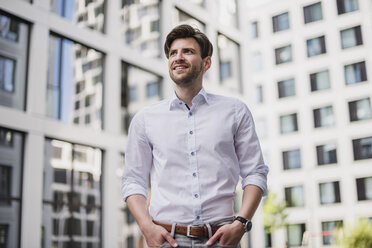 Portrait of smiling businessman in the city - DIGF04911