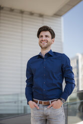 Portrait of smiling businessman in the city - DIGF04948