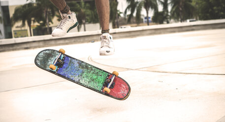 Close up of a skateboard spinning in mid air. - MINF08580