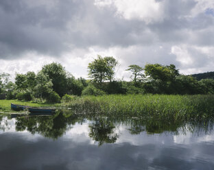 Blue wooden rowboat lying on the shore of Glenade Lake, Glenade, County Leitrim, Ireland. - MINF08677