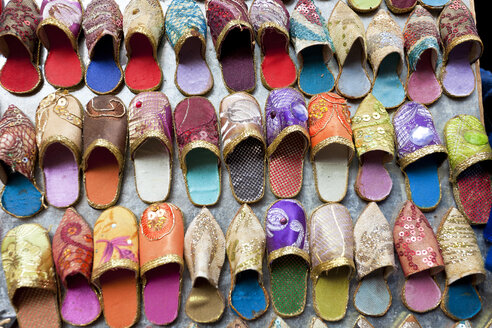 High angle close up of colourful leather slippers at a traditional North African market. - MINF08837