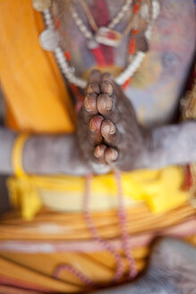 Close up of Buddhist's hands in prayer gesture. - MINF08841