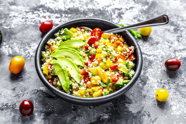 Bowl of bulgur salad with bell pepper, tomatoes, avocado, spring onion and parsley - SARF03919