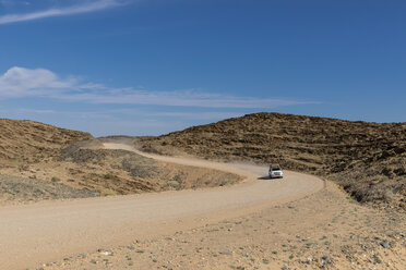 Africa, Namibia, Namib desert, Naukluft National Park, off-road vehicle on gravel road - FOF10072