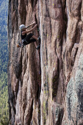 A athletic woman rock climbing near Bozeman, Montana. - AURF01037