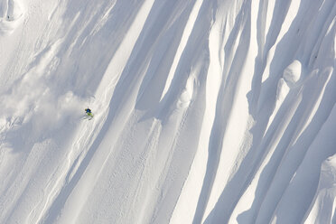 A male skier skis a huge new first descent in Haines, Alaska. - AURF01112