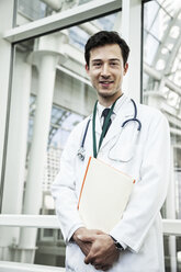 Portrait of a young Caucasian male doctor. - MINF08939