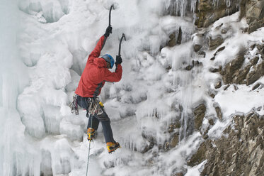 A man ice climbing a frozen waterfall, Silverton, Colorado. - AURF01149