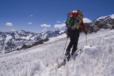 A man ski mountaineering through penitentes on Volcan San Jose in the Andes mountains of Chile - AURF01169