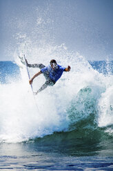 A progressive surfer catching air. - AURF01190