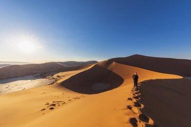 Africa, Namibia, Namib desert, Naukluft National Park, woman on sand dune 'Big Daddy' - FOF10087