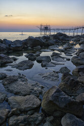 Italy, Abruzzo, San Vito Chietino, Trabocchi coast, Trabocco Turchino at sunrise - LOMF00734