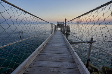 Italy, Abruzzo, San Vito Chietino, Trabocchi coast, Trabocco Turchino at sunrise - LOMF00735