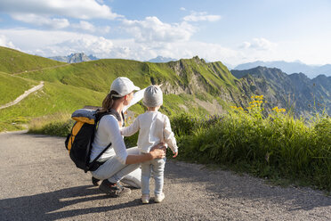 Germany, Bavaria, Oberstdorf, mother and little daughter on a hike in the mountains - DIGF04970