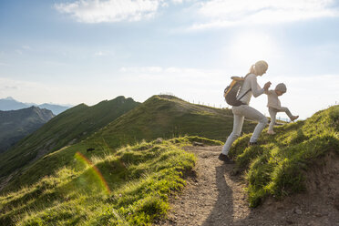 Germany, Bavaria, Oberstdorf, mother and little daughter on a hiking trip in the mountains - DIGF04980