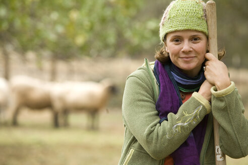 Portrait of young woman working on a farm. - AURF01448