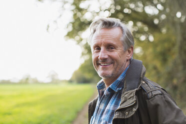 Portrait smiling, confident senior man in park - HOXF03711