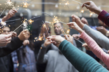 Friends celebrating with sparklers - CAIF21468