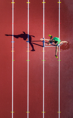 Aerial view of hurdler stock photo