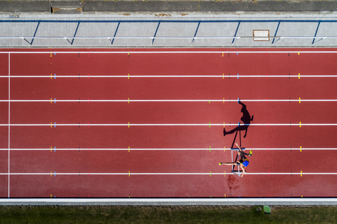 Aerial view of hurdler stock photo