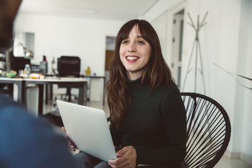 Young businesswoman having a team meeting in the office - SUF00538