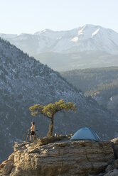 Woman sets up camp,Colorado. - AURF01547
