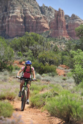 Woman rides the Templeton Trail in South Sedona, Arizona - AURF01637