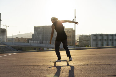 Young man riding skateboard in the city - AFVF01478