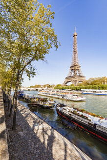 France, Paris, Eiffel Tower and tour boat on Seine river - WDF04793
