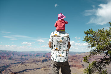 USA, Arizona, Grand Canyon National Park, father and baby girl enjoying the view, carrying on shoulders, rear view - GEMF02364