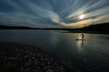 A man paddle boarding in the evening in Kittery, Maine. - AURF02049