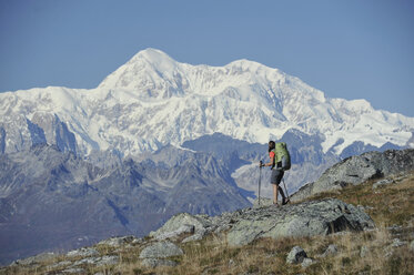 Backpacker hikes Kesugi Ridge Trail in Denali State Park, Alaska. - AURF02150