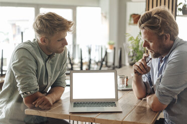 Business partners having a meeting in their new start-up company - GUSF01248